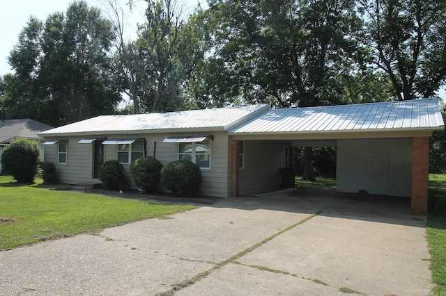 ranch-style house with a carport and a front yard