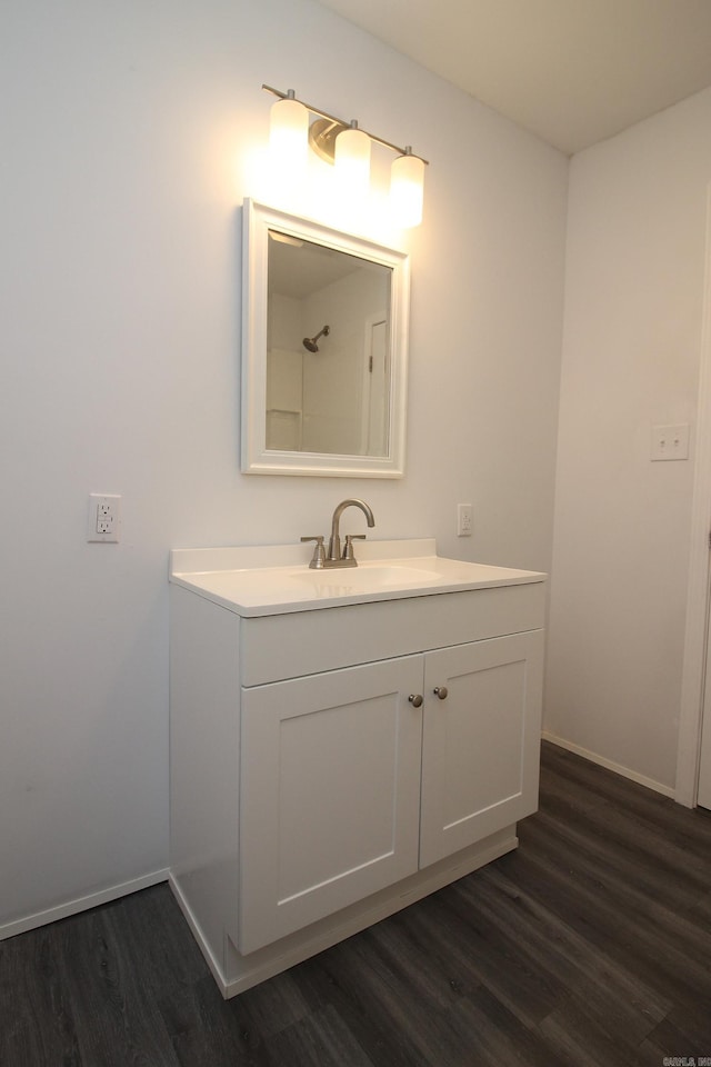 bathroom featuring hardwood / wood-style floors and vanity