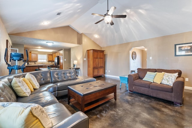 living room featuring ceiling fan and lofted ceiling