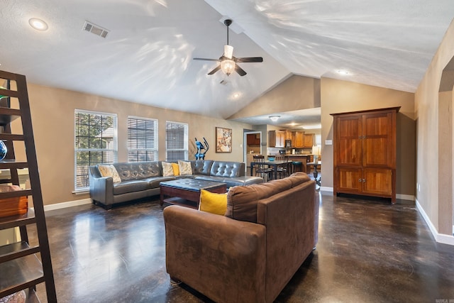 living room featuring a textured ceiling, ceiling fan, and lofted ceiling