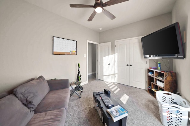 living room with ceiling fan and carpet floors