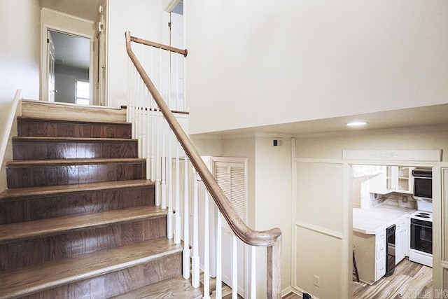 staircase featuring hardwood / wood-style floors