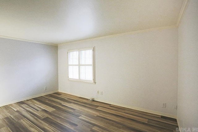 spare room featuring crown molding and dark wood-type flooring