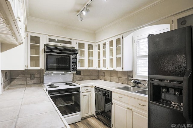 kitchen featuring white cabinetry, tile counters, sink, backsplash, and black appliances