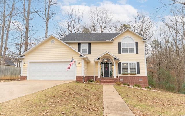 front facade with a garage and a front lawn