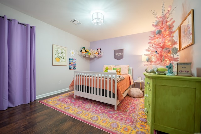 bedroom with dark wood-type flooring