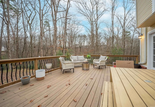 wooden terrace featuring outdoor lounge area