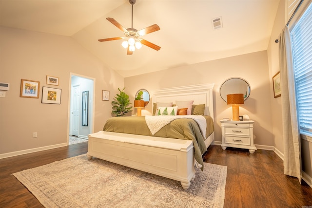 bedroom with ceiling fan, dark hardwood / wood-style flooring, and vaulted ceiling