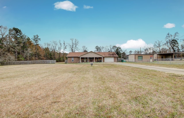 ranch-style home featuring a front yard and a garage