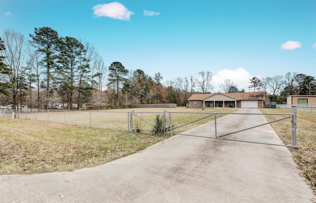 exterior space featuring a front lawn and a garage