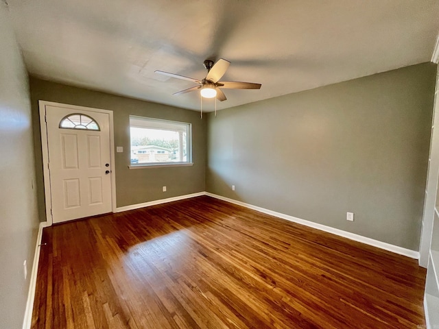 foyer entrance featuring ceiling fan and dark hardwood / wood-style flooring