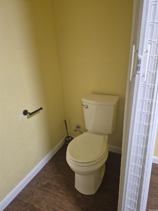 bathroom featuring toilet and hardwood / wood-style flooring