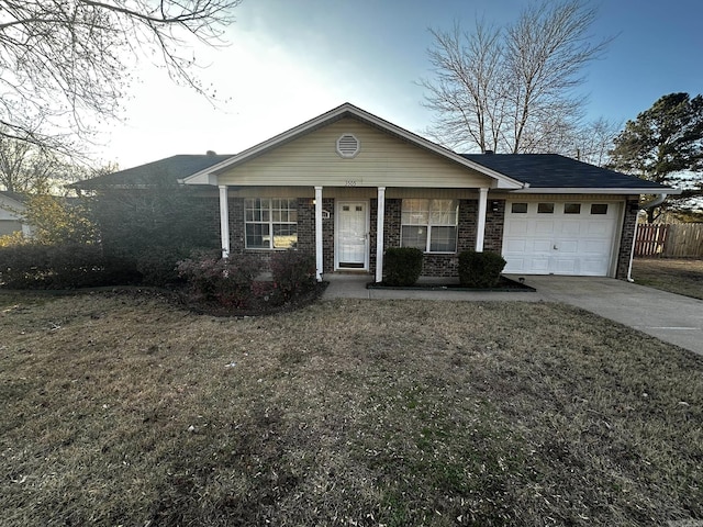 single story home featuring a garage and a front yard