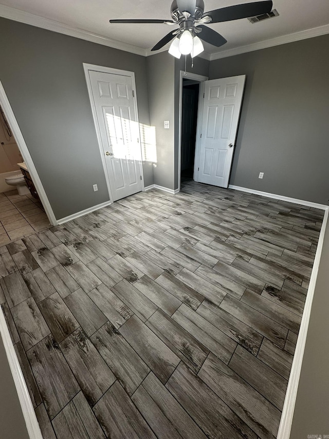 interior space featuring ceiling fan and ornamental molding