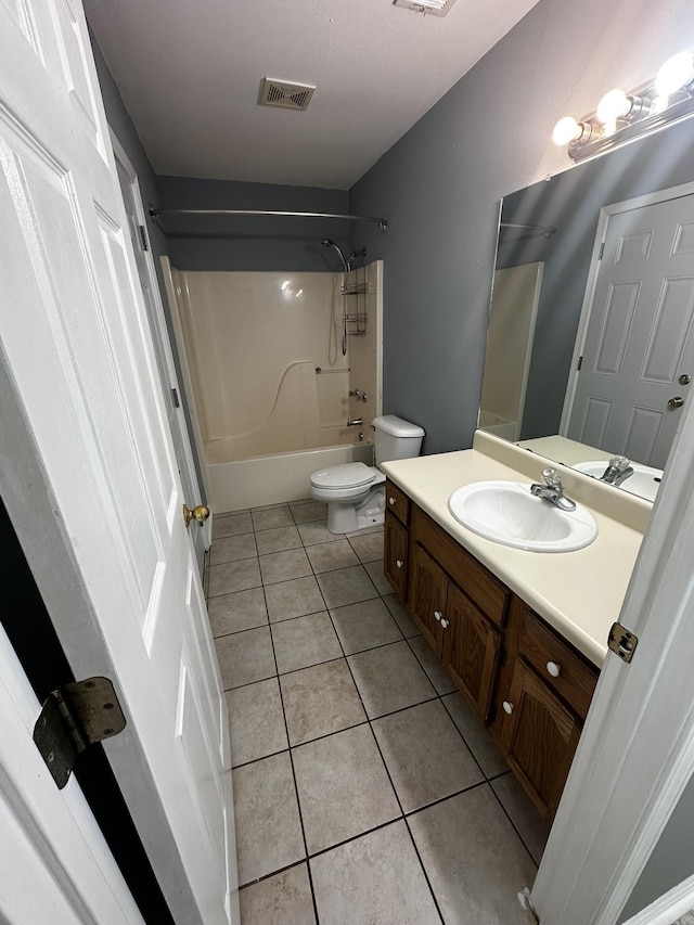 full bathroom with tile patterned flooring, vanity, bathing tub / shower combination, and toilet