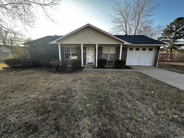 ranch-style home with a front lawn and a garage