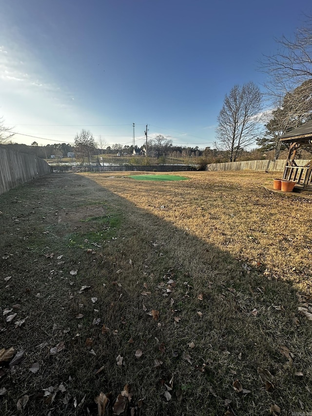 view of yard with a rural view