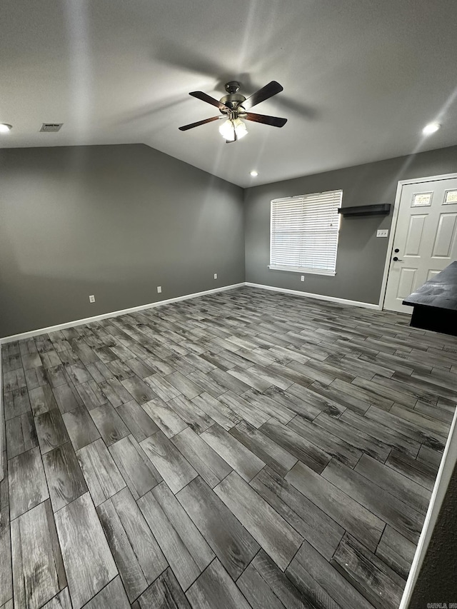 unfurnished room featuring ceiling fan and vaulted ceiling