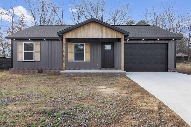 single story home with a porch and a garage