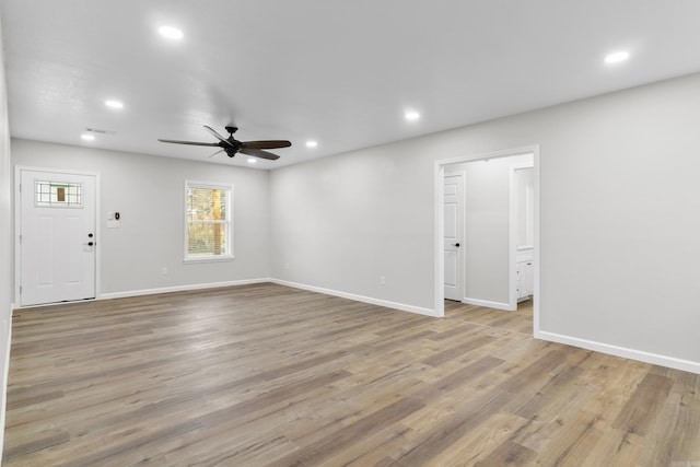 interior space with ceiling fan and light hardwood / wood-style floors