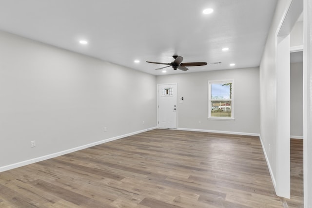 spare room with ceiling fan and light hardwood / wood-style floors