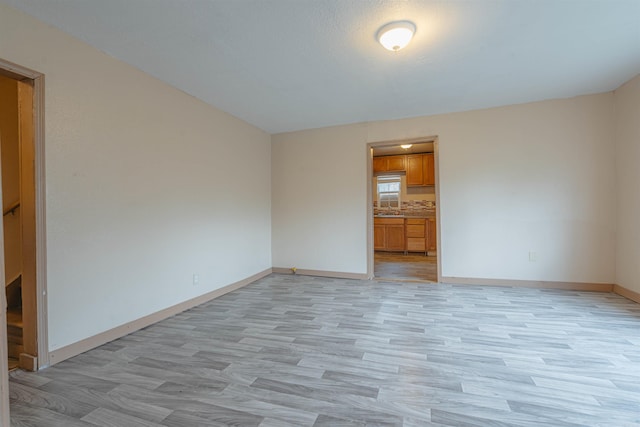 empty room with light wood-type flooring