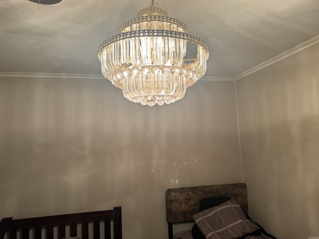 interior details with a chandelier and ornamental molding