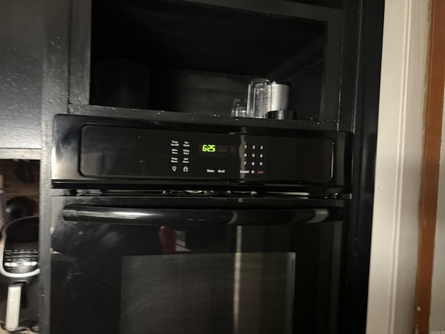 room details featuring black oven