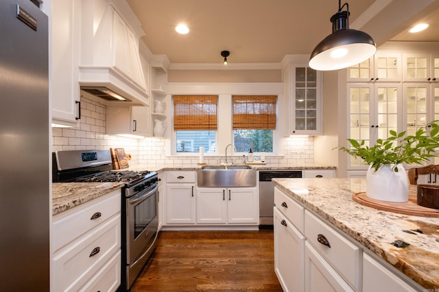 kitchen featuring sink, white cabinets, and appliances with stainless steel finishes