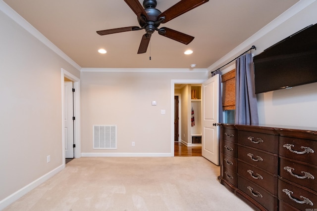 bedroom with ceiling fan, crown molding, and light carpet