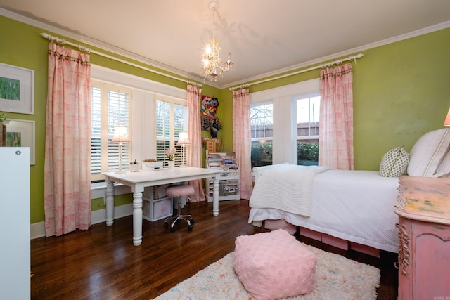 bedroom with crown molding, dark hardwood / wood-style floors, and a notable chandelier