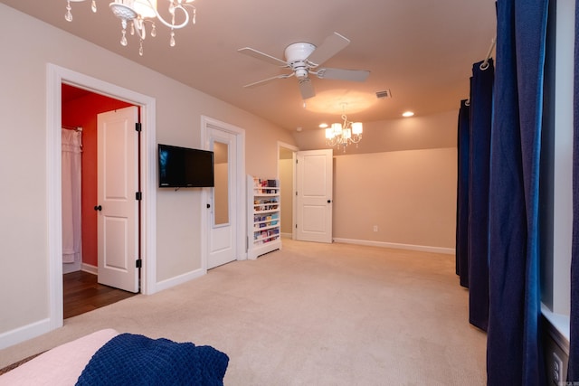 carpeted bedroom featuring lofted ceiling and an inviting chandelier