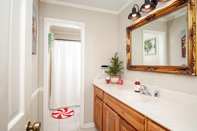 bathroom featuring tile patterned flooring, a textured ceiling, vanity, and ornamental molding