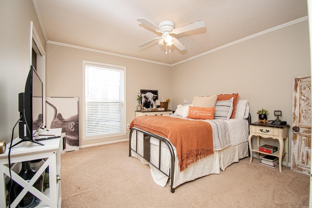 carpeted bedroom featuring ceiling fan and ornamental molding