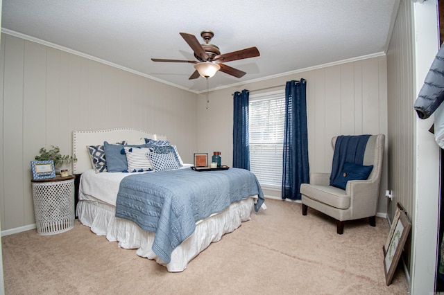 carpeted bedroom with ceiling fan, ornamental molding, and a textured ceiling