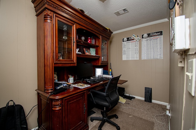 office area with wood walls, carpet floors, a textured ceiling, and ornamental molding