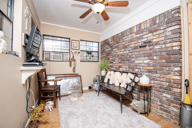 tiled home office featuring crown molding, cooling unit, brick wall, and ceiling fan