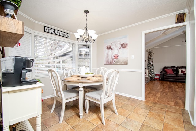 dining area with light tile patterned flooring, ornamental molding, a textured ceiling, and a notable chandelier