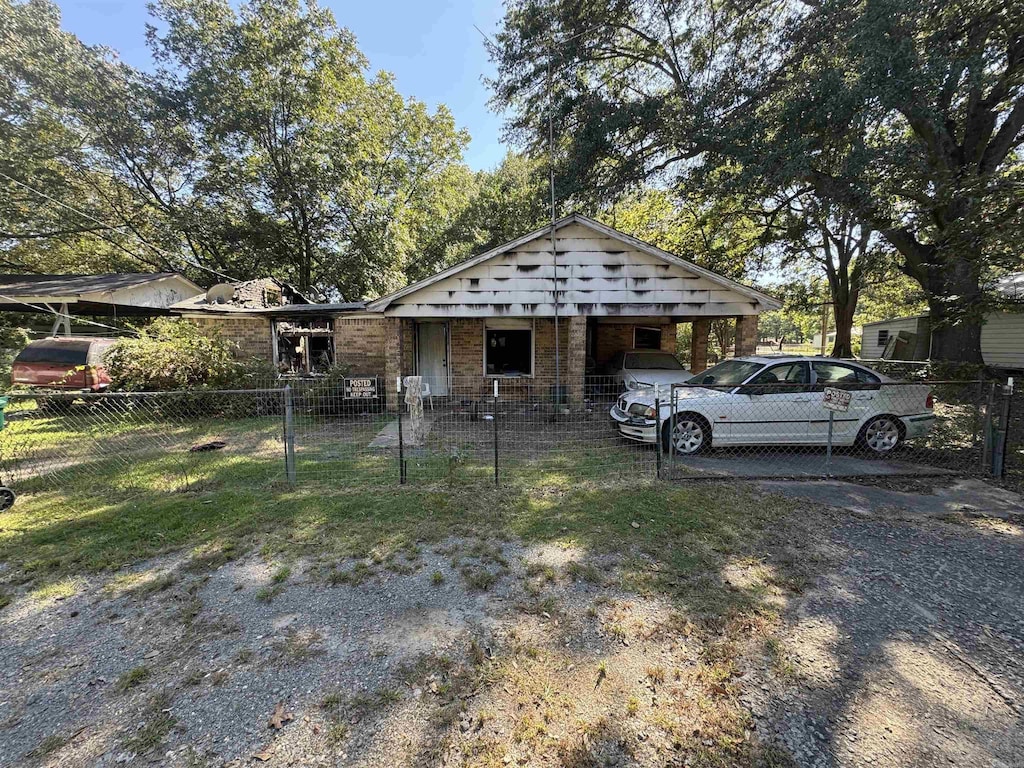 view of front of home with a carport