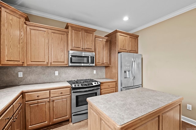 kitchen with decorative backsplash, appliances with stainless steel finishes, crown molding, a kitchen island, and light tile patterned flooring