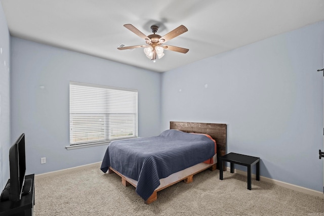 bedroom featuring ceiling fan and carpet floors