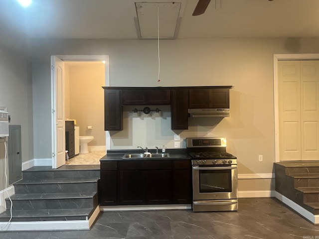 kitchen featuring stainless steel range with gas cooktop, sink, and ceiling fan