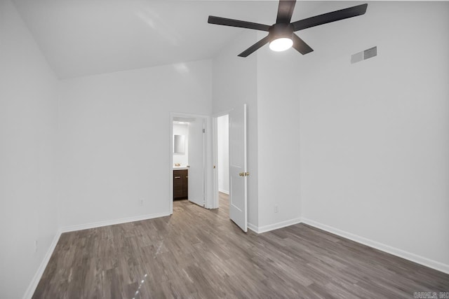 interior space featuring ceiling fan, high vaulted ceiling, and hardwood / wood-style flooring