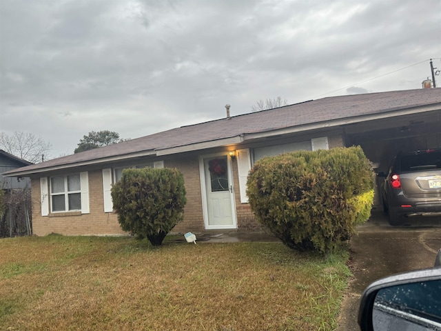 ranch-style home with a front lawn