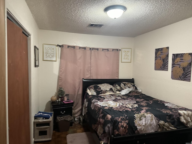 bedroom with a textured ceiling