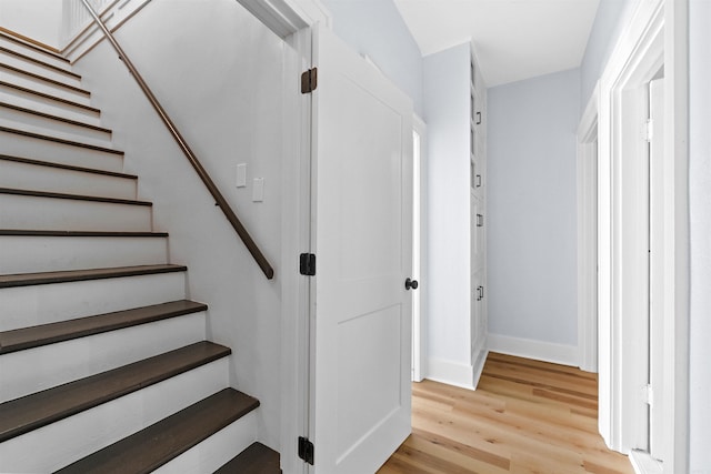 stairway featuring hardwood / wood-style flooring