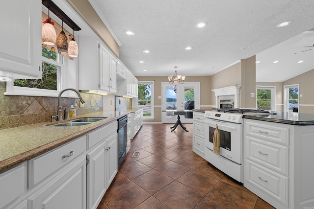 kitchen featuring tasteful backsplash, white range oven, sink, dishwasher, and white cabinets