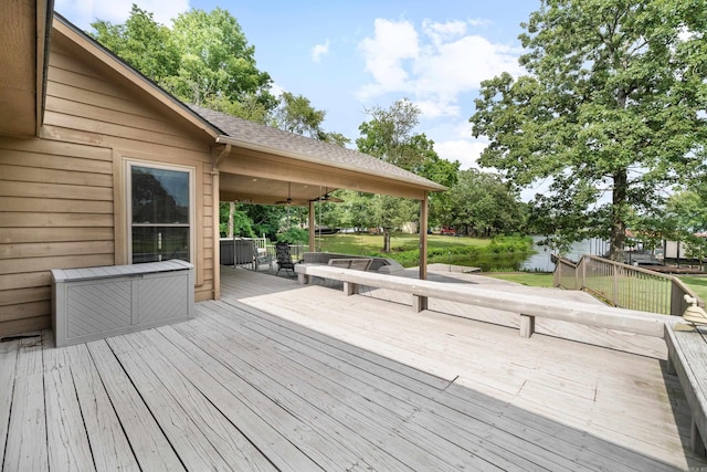 wooden terrace featuring ceiling fan