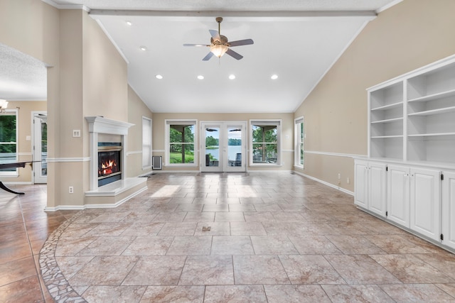 unfurnished living room featuring ceiling fan, beam ceiling, high vaulted ceiling, and french doors