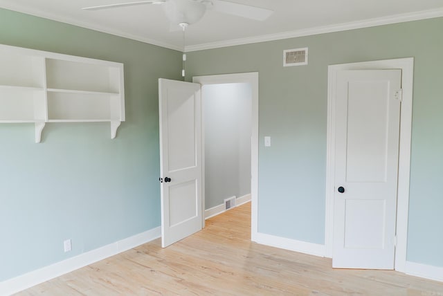 unfurnished bedroom with light wood-type flooring, ceiling fan, and ornamental molding